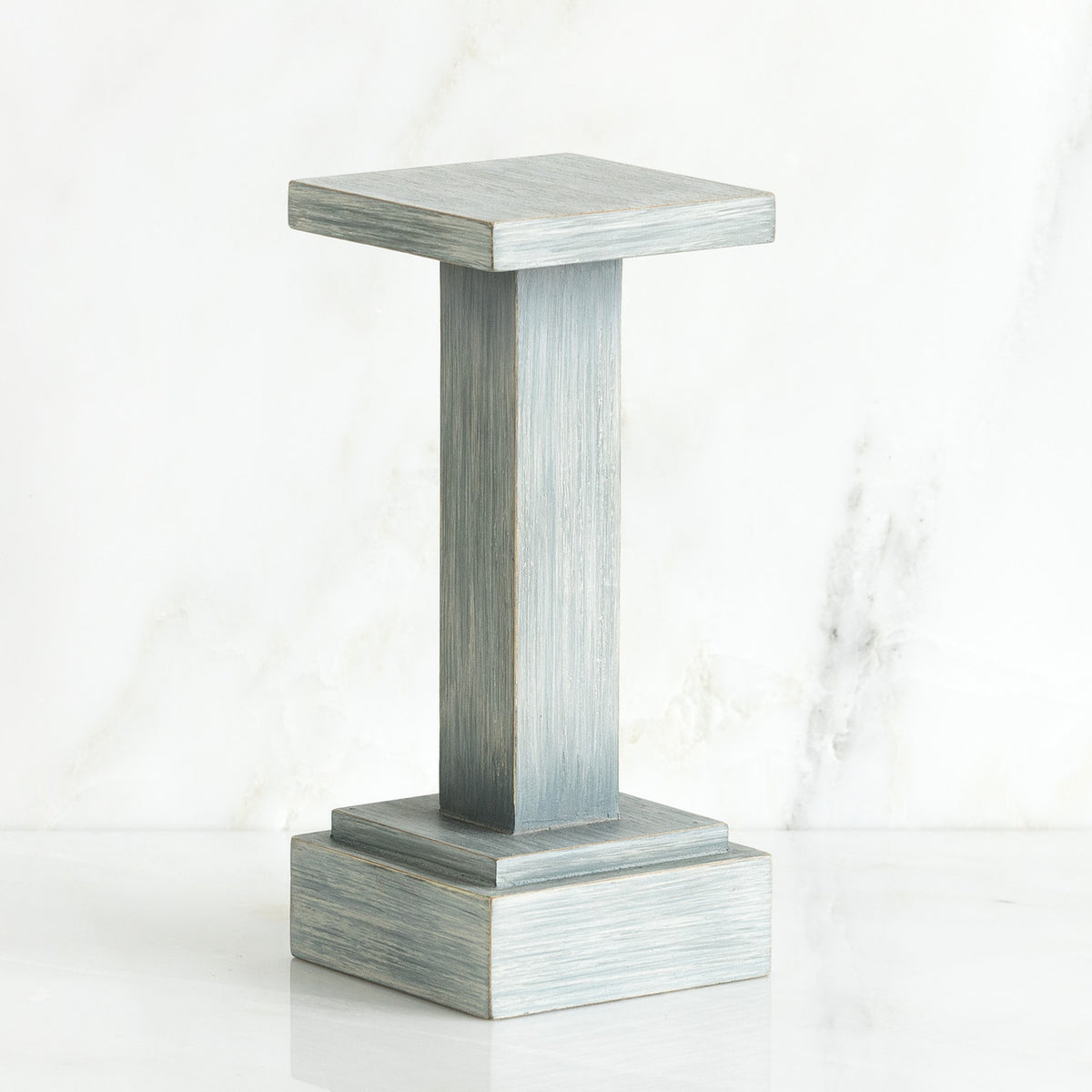 Standing white wooden pedestal stand against white background