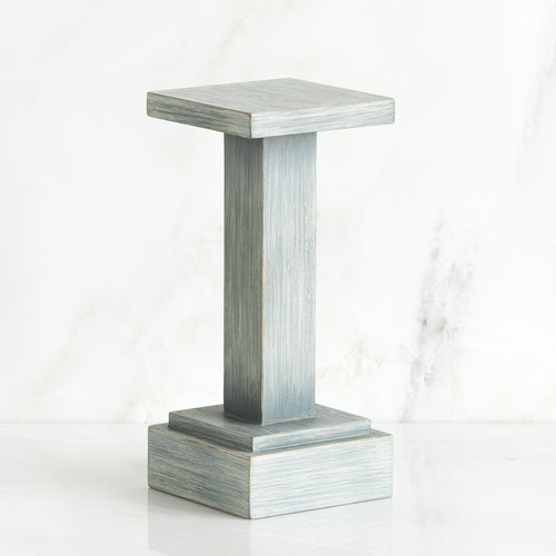 Standing white wooden pedestal stand against white background