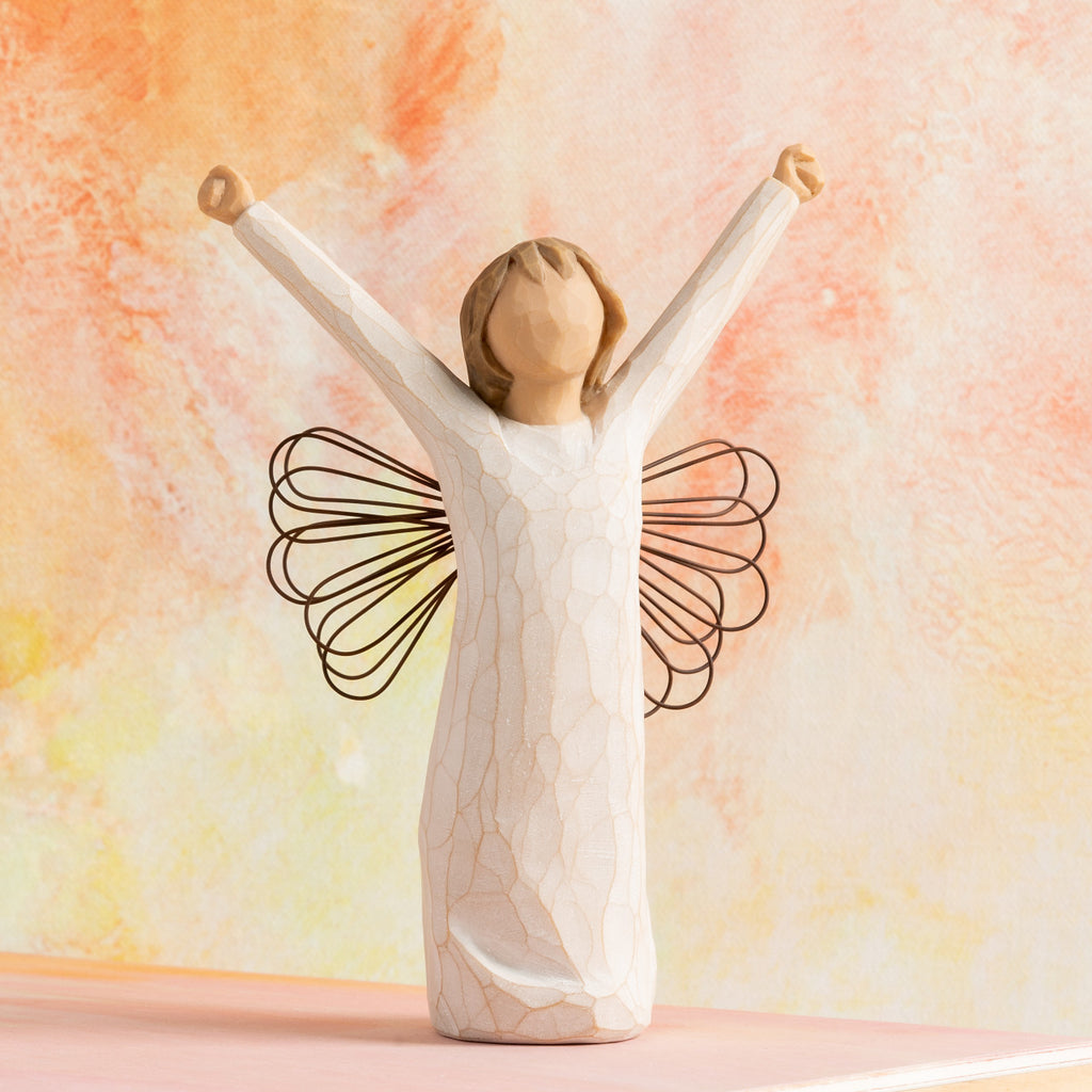 Willow Tree Courage, 6”h hand-painted standing resin angel figure in cream dress with wire wings, both arms upraised, in front of orange painting