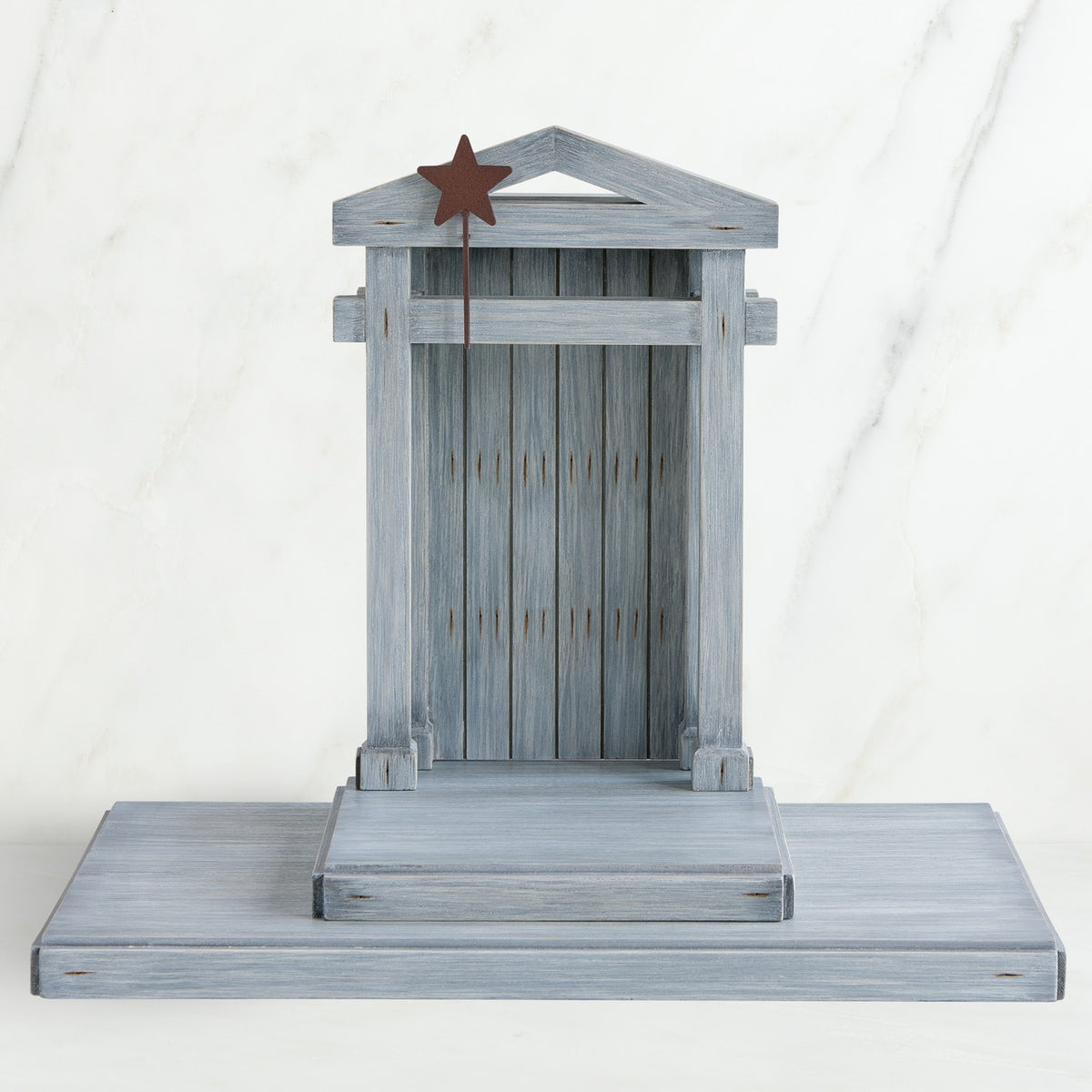 Grey wooden barn figurine open - brown star standing on it