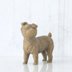 Small golden/grey dog figurine standing up