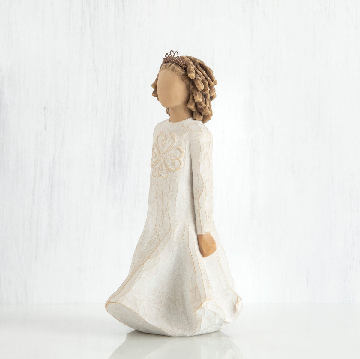 Side view of brunette woman wearing white dress standing up