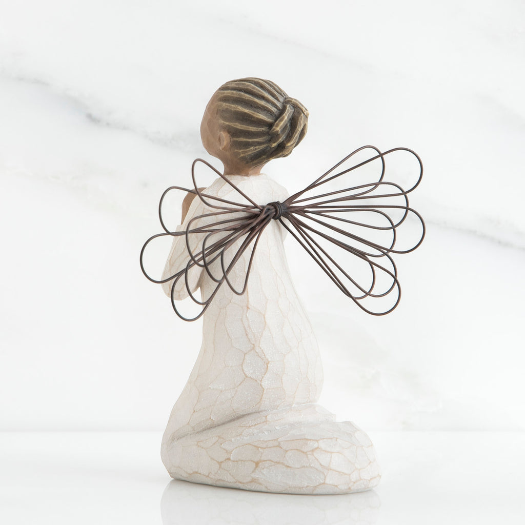 Small brunette girl figurine in white dress kneeling with brown wire wings