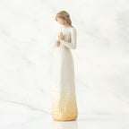 Brunette girl figurine in white dress holding arms up
