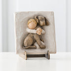 Cream square plaque stand with boy hugging brown puppy carved in
