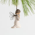 Side view figure of female angel in cream dress and wire wings, kneeling in prayer position, ornament loop on head