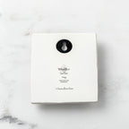 Back of white plaque reading piece name and sentiment, with Willow Tree logo