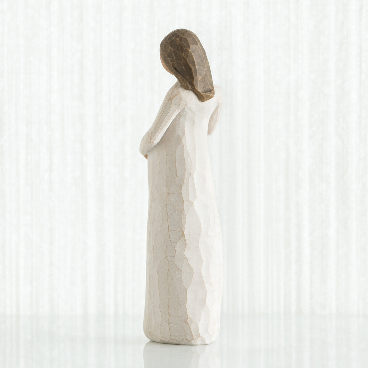 Back view of brunette girl in white dress
