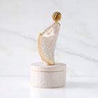 Right view: oval resin box, with profile of 3-D figure in cream and gold carved dress
