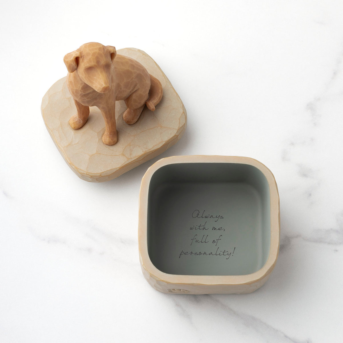 Inside: putty-colored square resin box with sentiment written on bottom inside of box. Detached lid