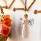Willow Tree a tree, a prayer Ornament, 4”h hand-painted resin angel figure in cream dress with wire wings, hands in prayer position, tree carving on dress, brown elastic cord, hanging on decorative rack