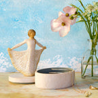 Willow Tree Butterfly Keepsake Box, 6.5"h x 4.5"h hand-painted oval resin box, 4.75”h figure holding cream skirt with carvings of monarch butterfly affixed to lid, open with jewelry inside