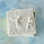 Willow Tree A Healing Wish Keepsake Box, 5"sq x 1.75"H hand-painted off-white resin box, detatched lid carved with organic/figural symbols, sentiment inside lid and velvety finish inside base, on blue painting
