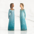 Front view of both lighter and darker-skin figures, arms clasped behind backs, hair and deep blue ombré garments dotted with gold leaf.