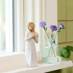 Willow Tree Here for You, 5”h hand-painted standing figure in cream dress, hands to heart in empathetic gesture, on bright windowsill